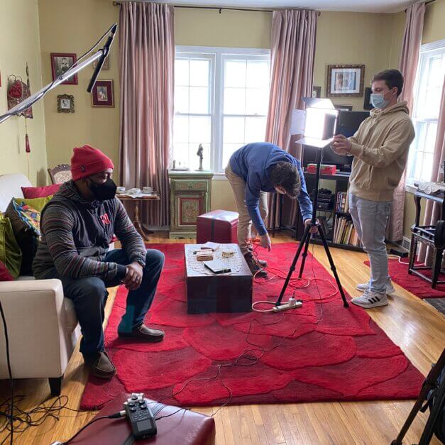 Filming Buxton documentary in living room.